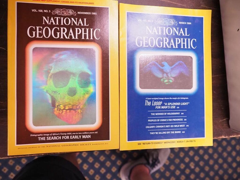 Two National Geographic magazines with