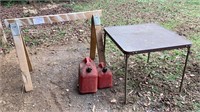 Wood saw horse, 2 gas cans, table