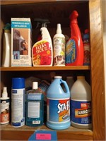 Two shelves full of cleaning supplies, most are