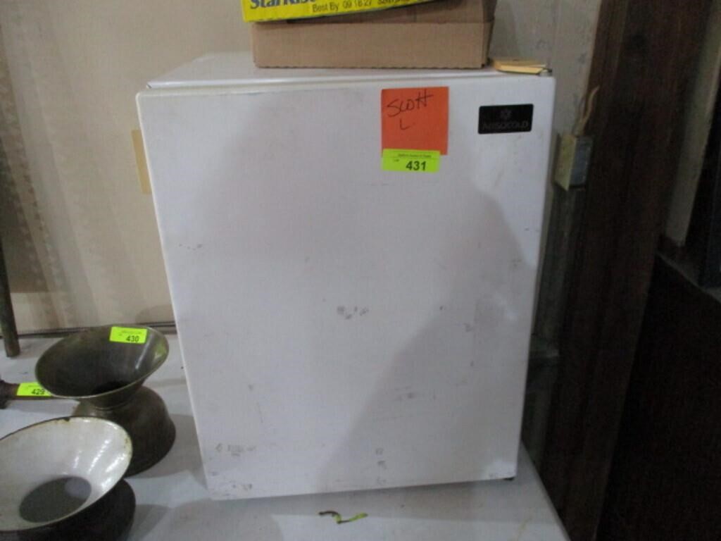 Small refrigerator (cools)