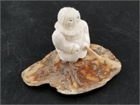 Small ivory carving of an ice fisher? With broken