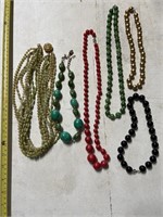 6 vintage beaded necklaces . One is 6 strand
