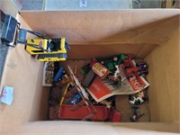 Box of toy cars and trucks one Tonka dozer