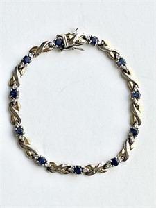 Sterling silver tennis bracelet w/blue stones