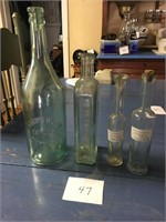 4 antique glass bottles