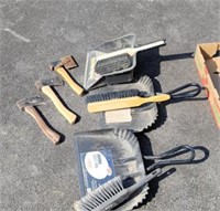 Hatchets and dust brooms and dust pans.