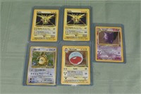 5 Pokémon Base set holographic cards in sleeves