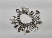 STERLING CHARM BRACLET WITH CHARMS - 62.36 GRAMS