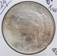 1924 BU and Toning Peace Silver Dollar.