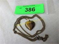 Tiger eye heart on sterling chain.