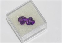 Two unset heart-shaped amethysts