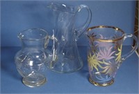 Three various glass water jugs