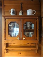 Norman Rockwell cups And cabinet