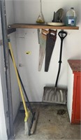 (G) Contents of corner including brooms, shovel,