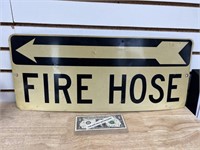 Vintage aluminum fire hose arrow advertising sign