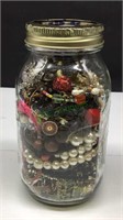 Quart size jar of assorted broken jewelry for