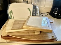 Large stack of cutting boards