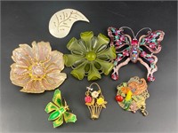 Flowers, butterflies and more brooches