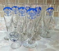 Eight Busch beer glasses plus one