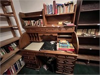 ROLL TOP DESK AND SHELVES OF BOOKS