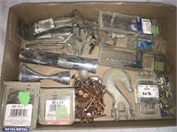 Assortment of nails, screws, drill bits, row
