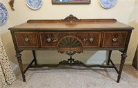 Ornate mahogany buffet with silverware tray