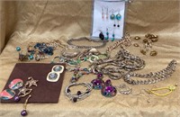 Mixed jewelry lot includes necklaces, earrings,