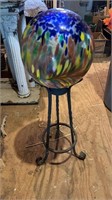 Colorful garden glass fairy ball on a iron stand,