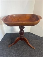 Antique wooden dough bowl on stand