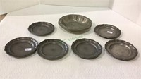 Pewter lot includes six coasters and a wine