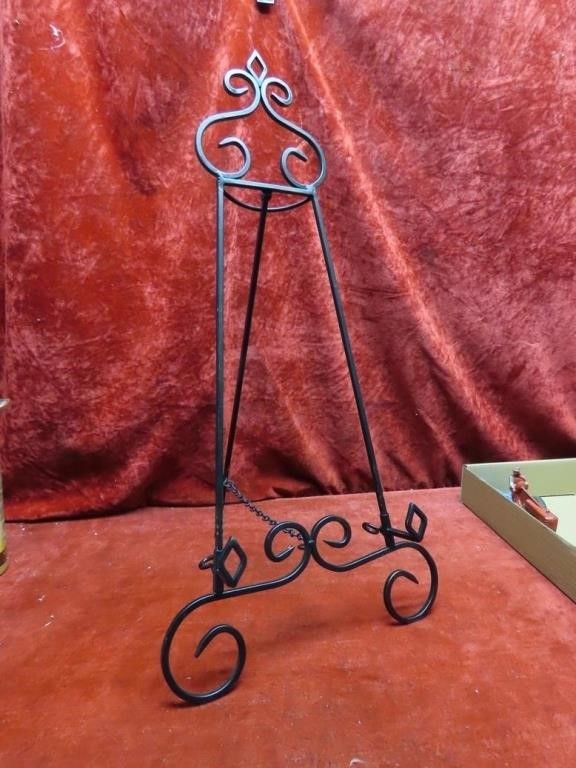 Wrought metal easel picture stand.