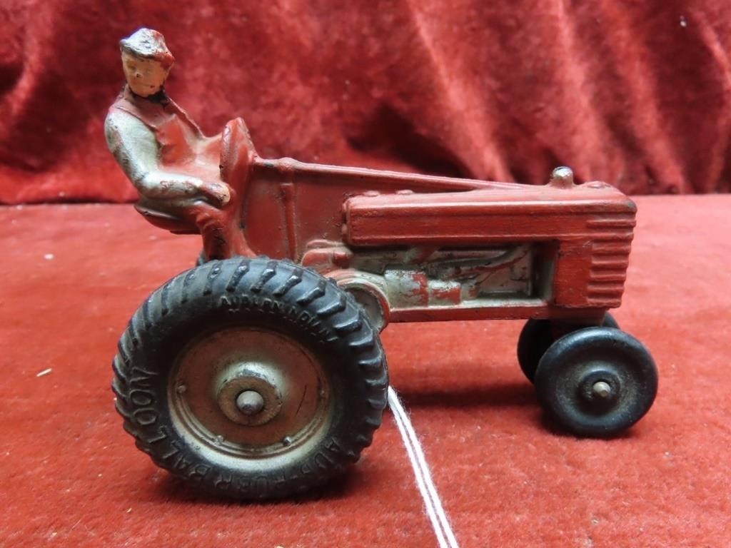 Vintage auburn rubber toys red tractor.