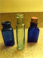 Collection of three vintage glass bottles