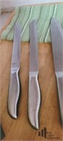 Set of Four Stainless Steel Knives & Cutting Board