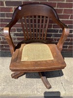 Antique Wooden Cane Bottom Rolling Desk Chair