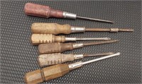 Assorted wooden handle screwdrivers.