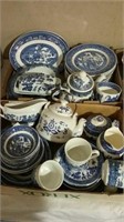 Two boxes of blue willow dish set