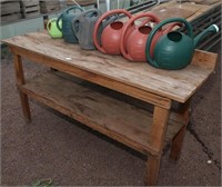 74" planter table, (6) watering cans, assorted