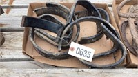 Assortment of hooks, horse shoes