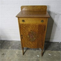 Antique tiger oak music cabinet w/key.