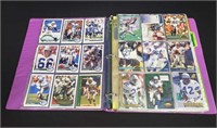 Binder of Seahawks and Cowboys football cards