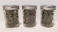 (3) Jars Of Marbles