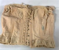 VINTAGE LADIES CORSET. HAS WORN AGE CONDITION.