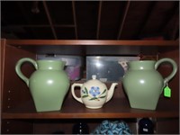 Pottery pitchers, teapot.