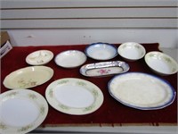 Assorted vintage plates and chargers.