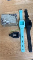 Three rubber Fitbit holders - two for the wrist,