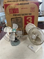 Box fan with box with three other tabletop fans