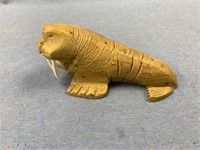 Soapstone walrus with ivory tusks initialed by art