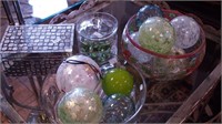 Group of decor items including glass bowl and
