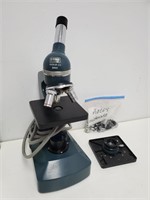 Vintage Cenco microscope and microscope piec